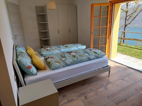 Bed in the bedroom of the Crandola holiday home
